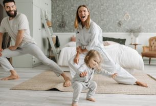 A joyful family engaging in morning stretches together, fostering a fun and healthy routine.